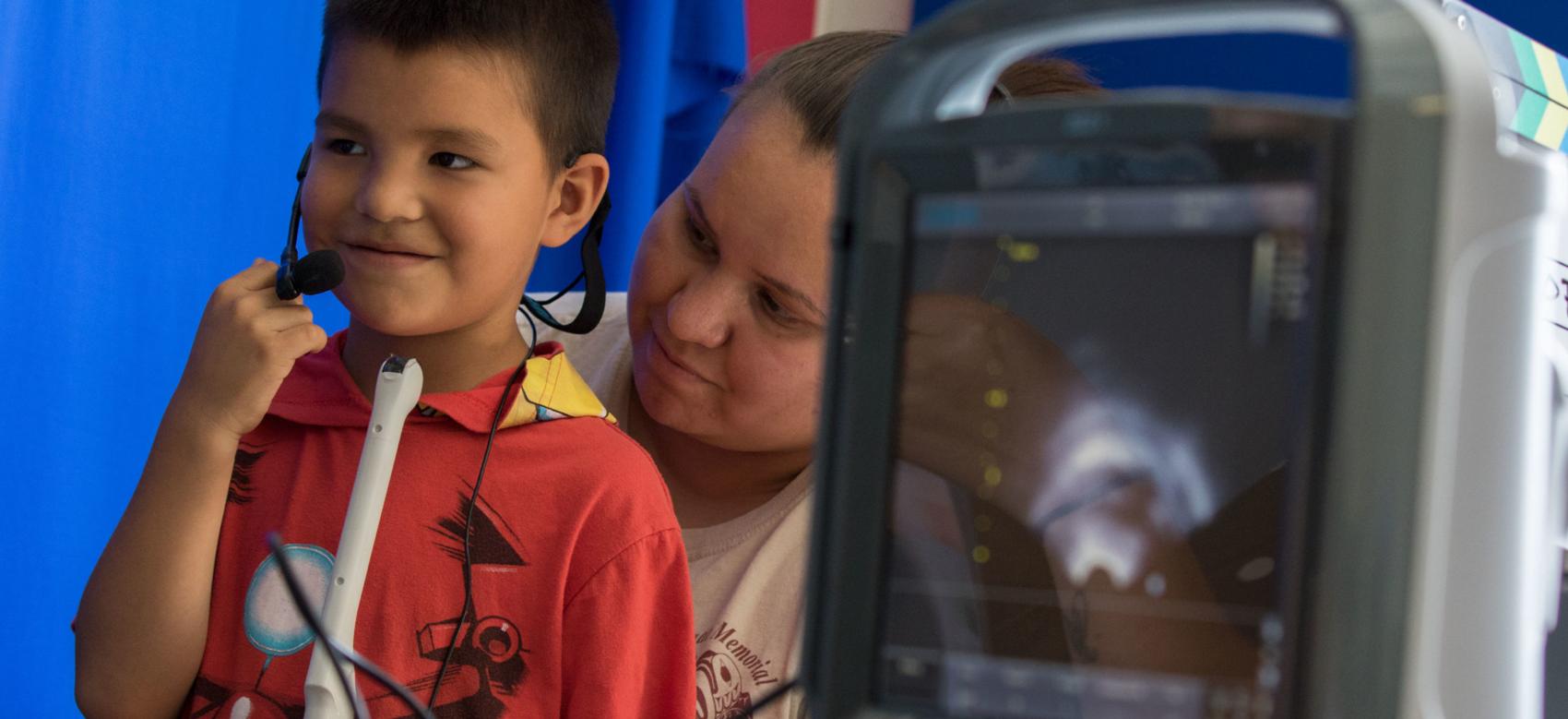 A boy and his mother work to preserve the first language of the W̱SÁNEĆ First Nation of Vancouver Island with the use of an ultrasound device