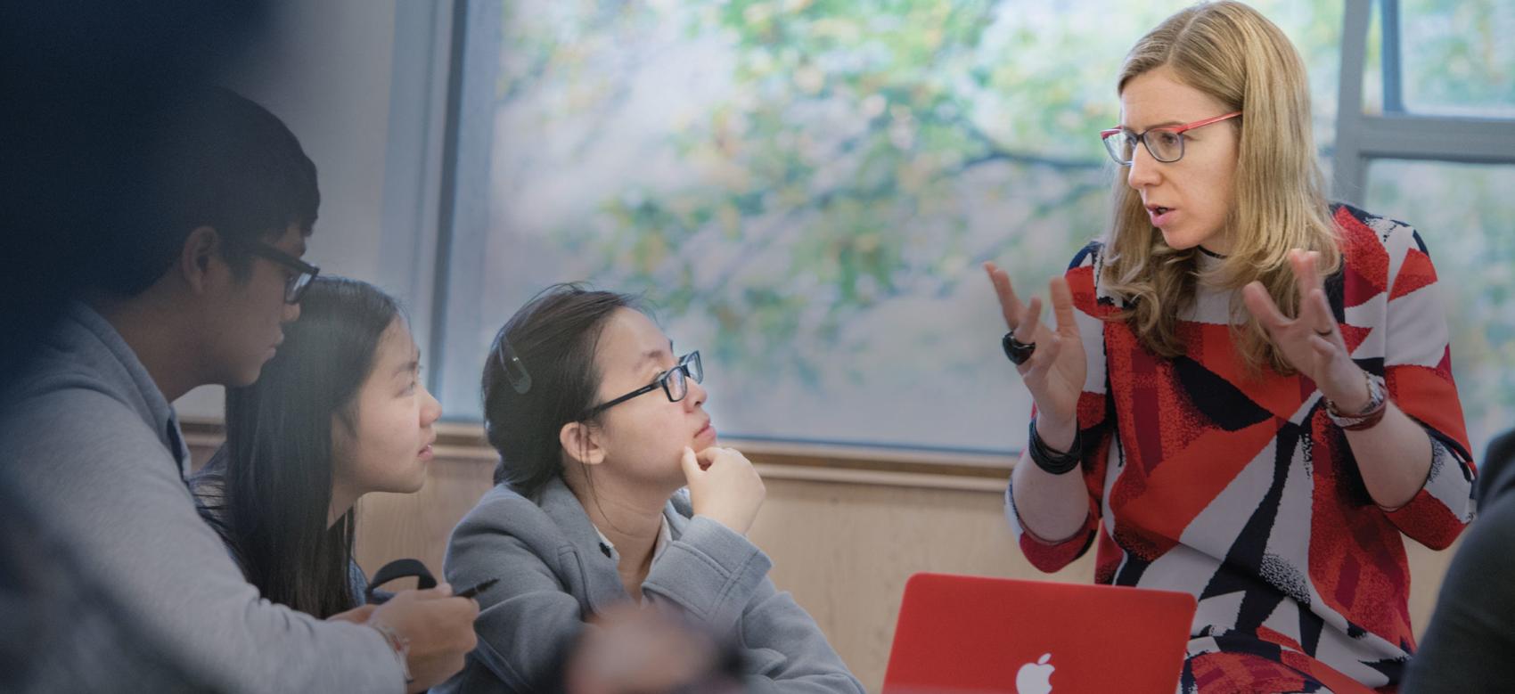Student and a professor discuss an augmented reality app about the Syrian civil war during a UBC geography class