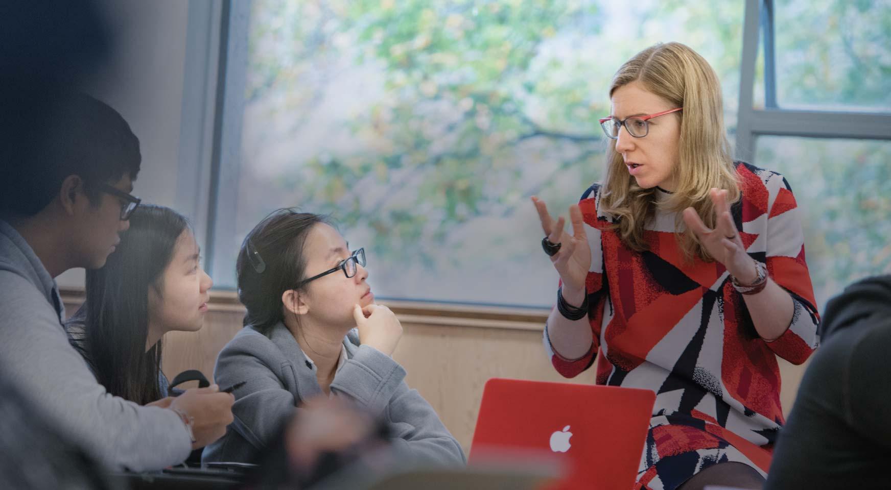 Student and a professor discuss an augmented reality app about the Syrian civil war during a UBC geography class