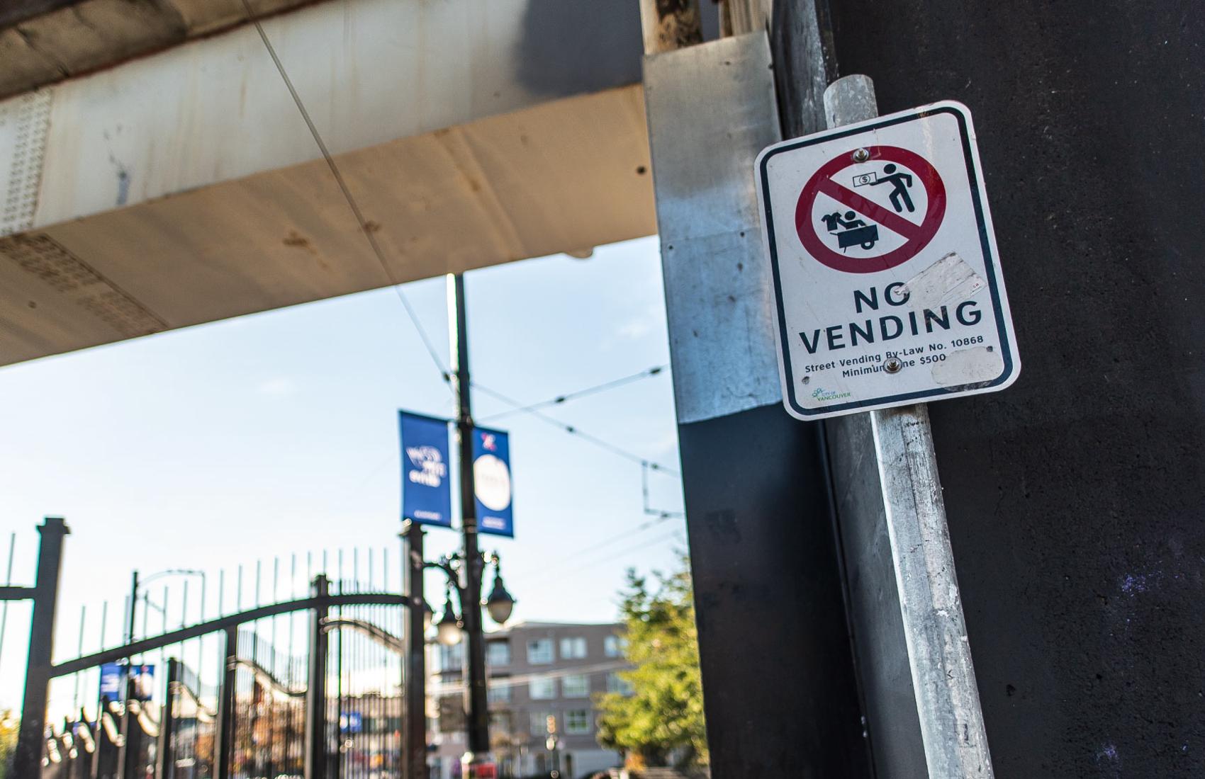 A City of Vancouver sign that says "No Vending" is posted along Commercial Drive