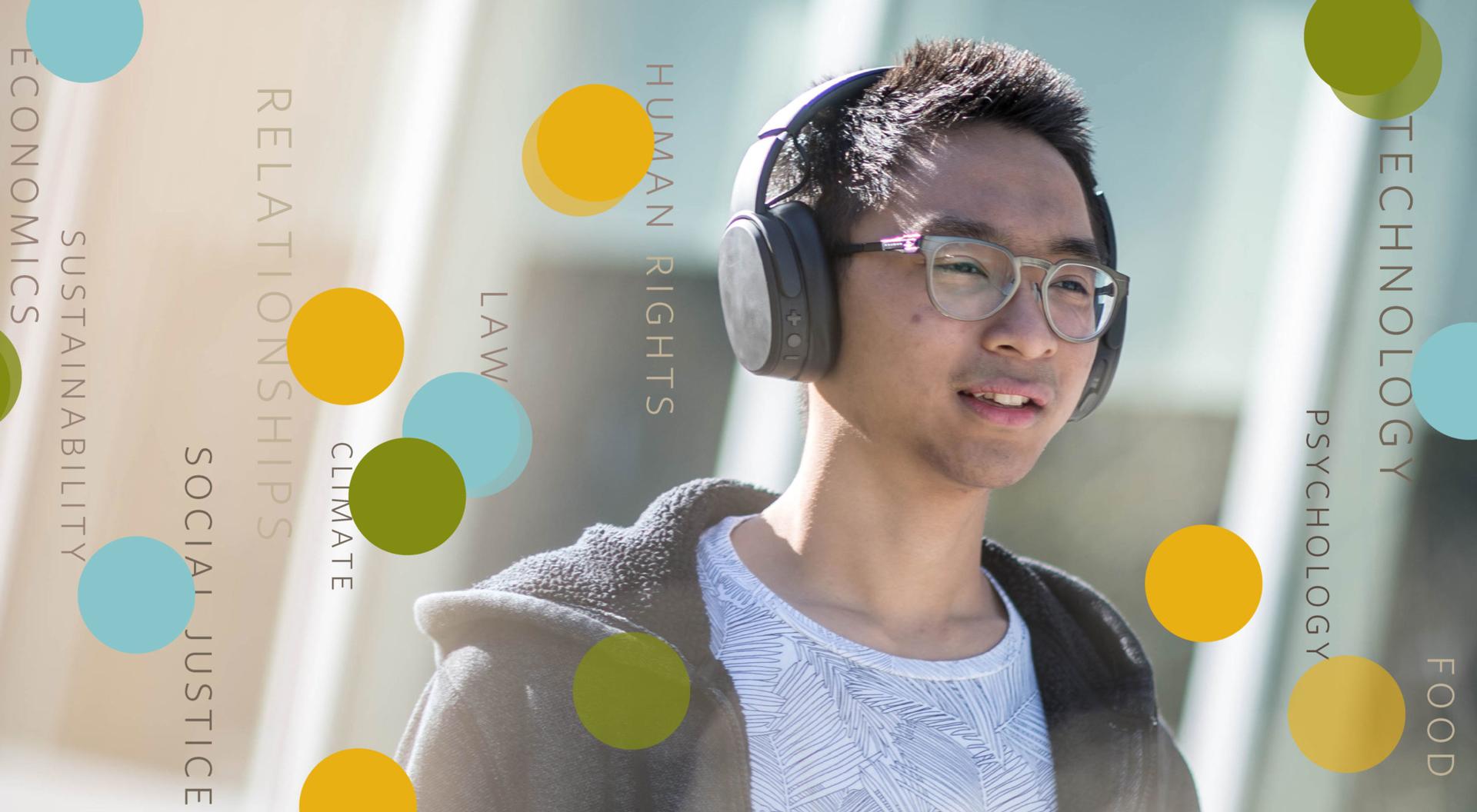 A person listens to UBC talks on his headphones