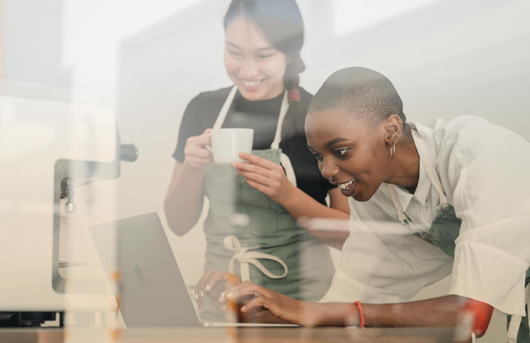 Two women work together
