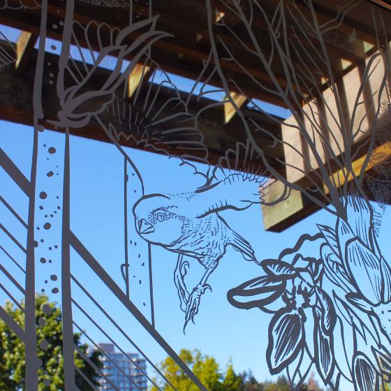 A detail of a windows at the UBC Botanical Gardens, which have been covered in artistic decals to prevent birds from hitting windows.