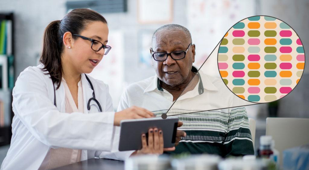 A doctor and a senior patient look at the patient's personalized genomic sequencing results on a tablet in a doctors office