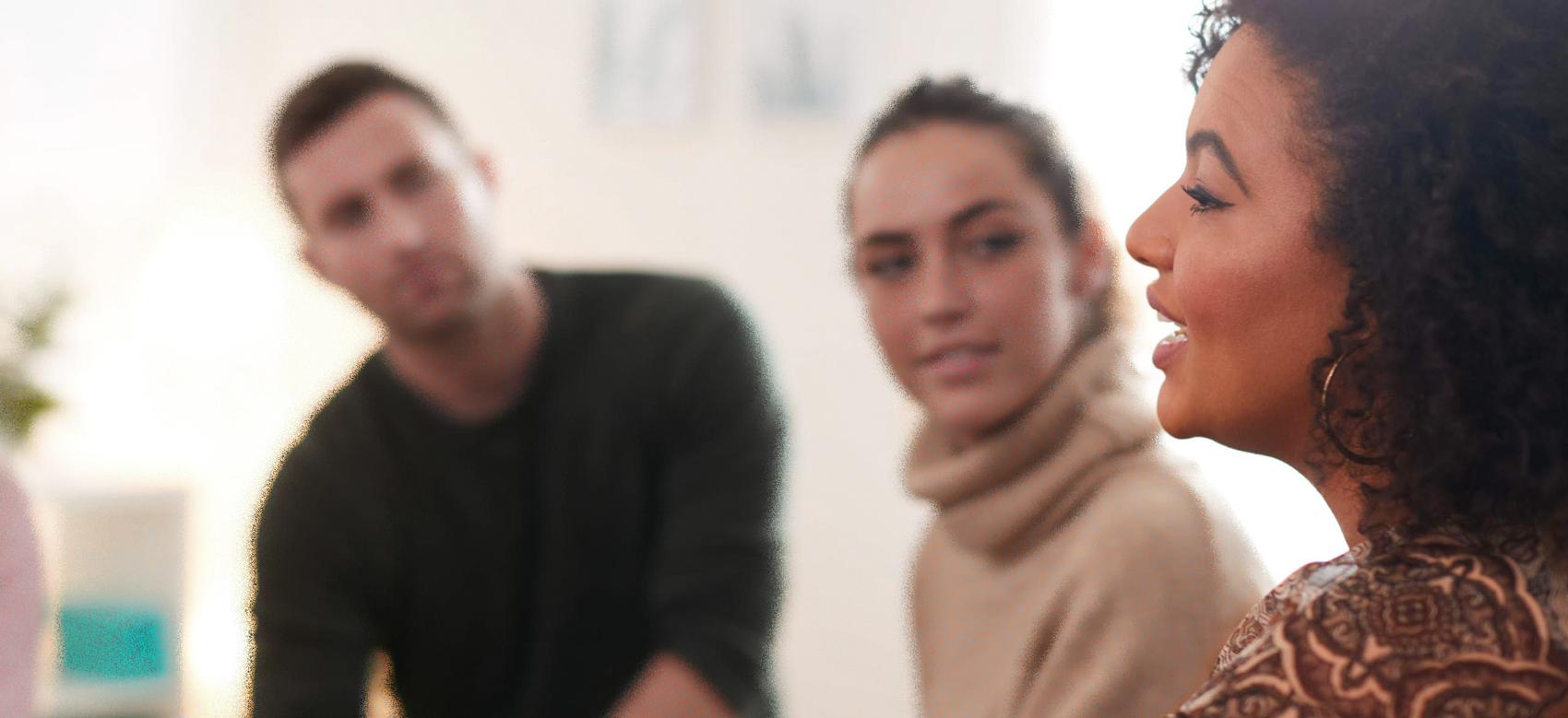 People gathered in discussion about mental health.