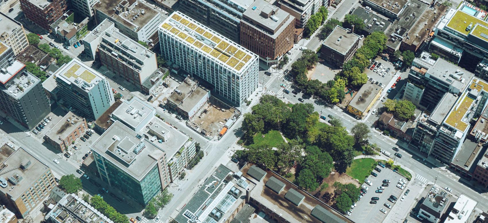 Aerial view of a city with dense apartment blocks.