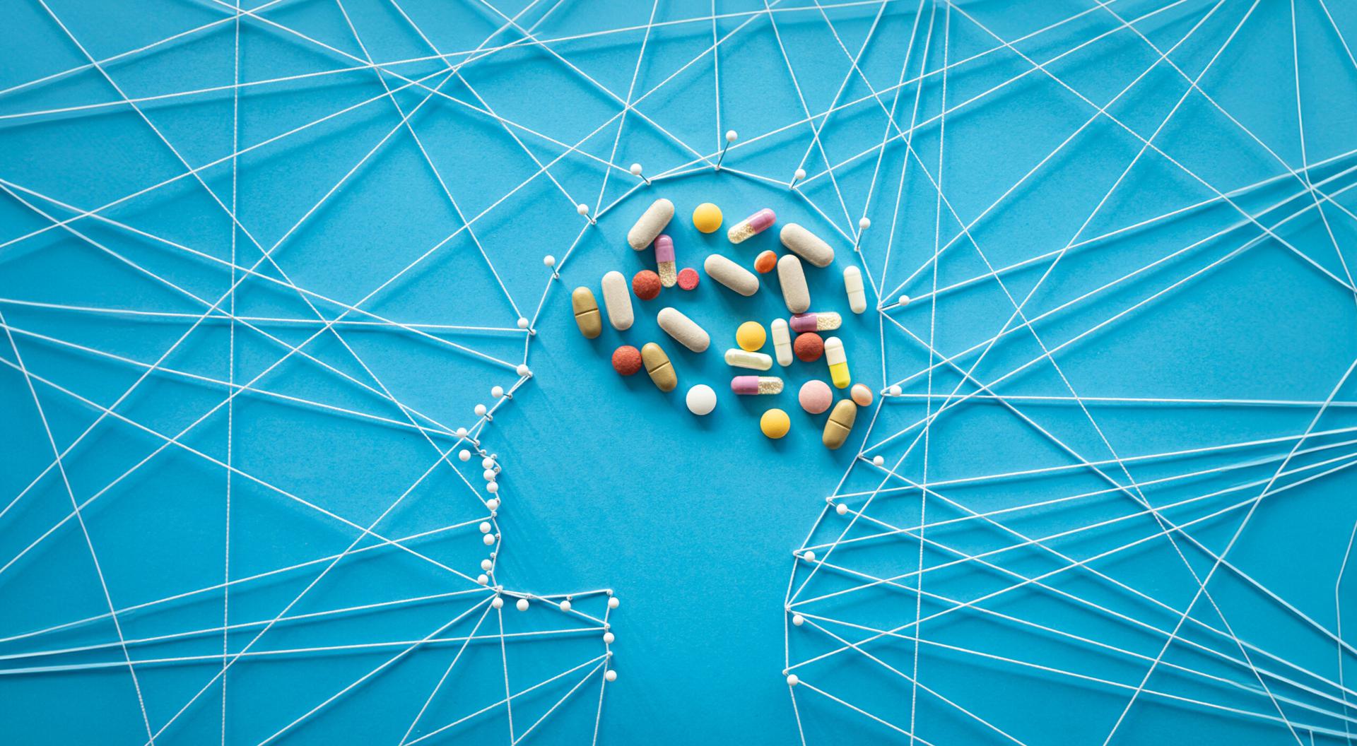 Pins and threads in the shape of a a human head.