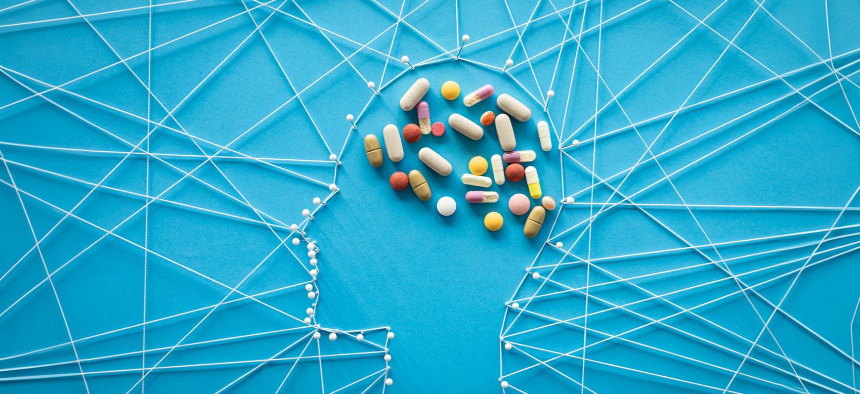 Pins and threads in the shape of a a human head.